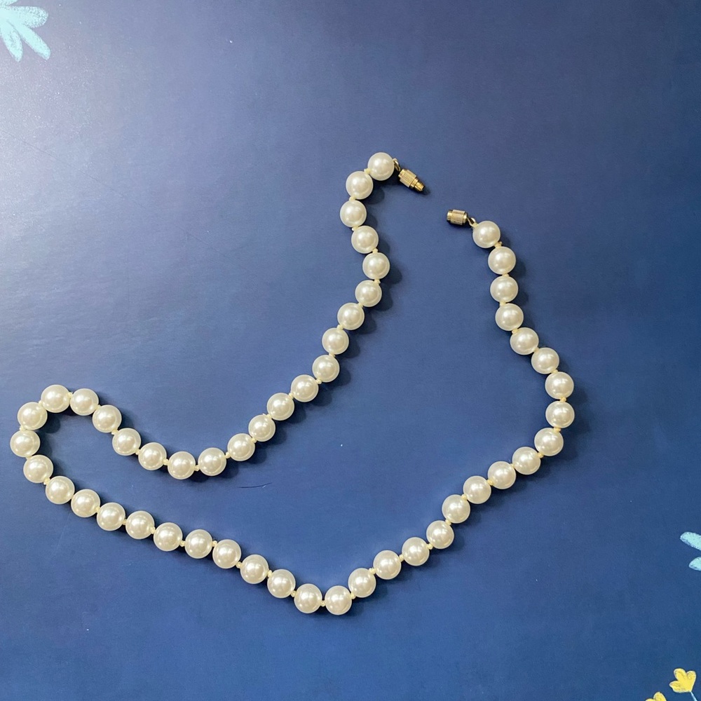 Faux pearl necklace.
